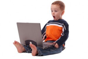 Little Boy Using a Laptop Little Boy Using a Laptop