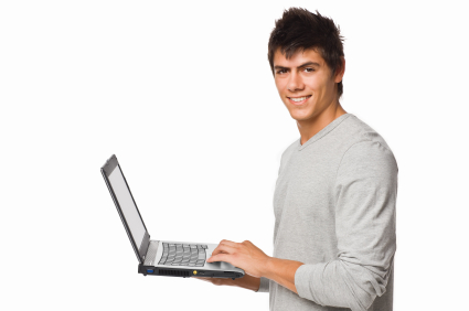 Side view of a young boy using laptop isolated on white backgrou