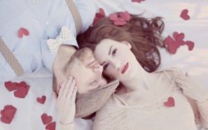 couple on picnic blanket_romantic valentines paper heart confetti red cream soft light_